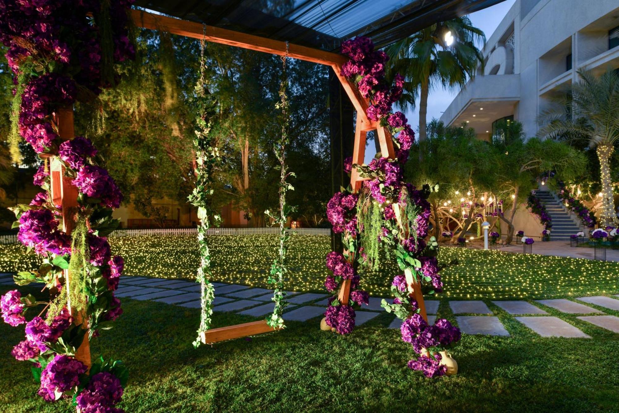 The Ritz-Carlton, Doha Hotel Exterior photo The garden at the Four Seasons Hotel, Miami