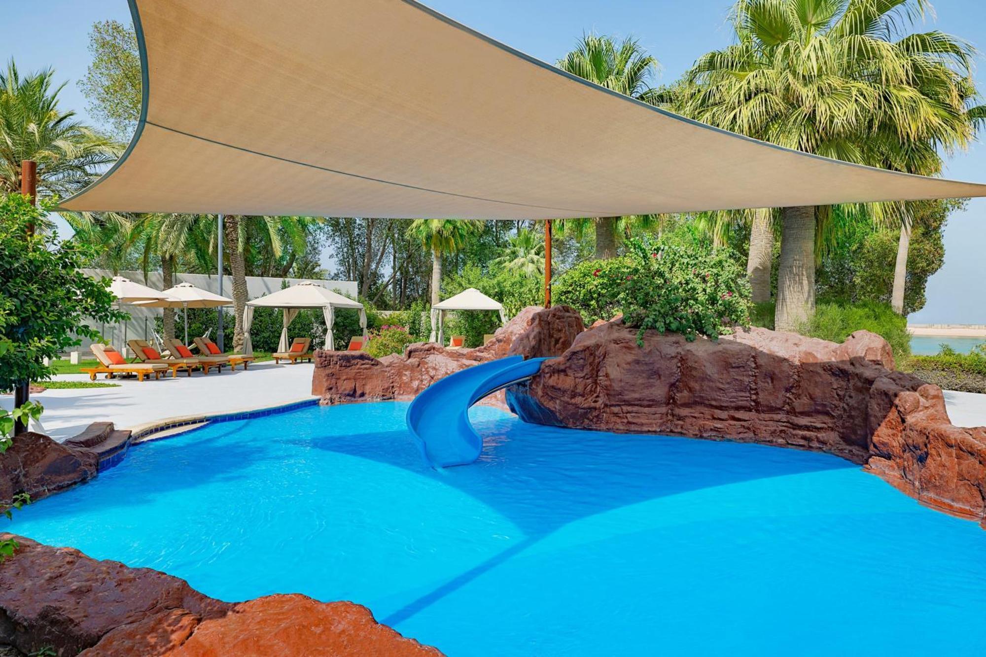 The Ritz-Carlton, Doha Hotel Exterior photo Shade sail over a pool